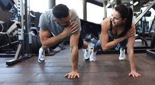 Toning Bingo Wings: Your Ultimate Guide to Sculpting Sleek Arms at the Gym 3 Fitness trainer demonstrating arm toning exercises Purfleet