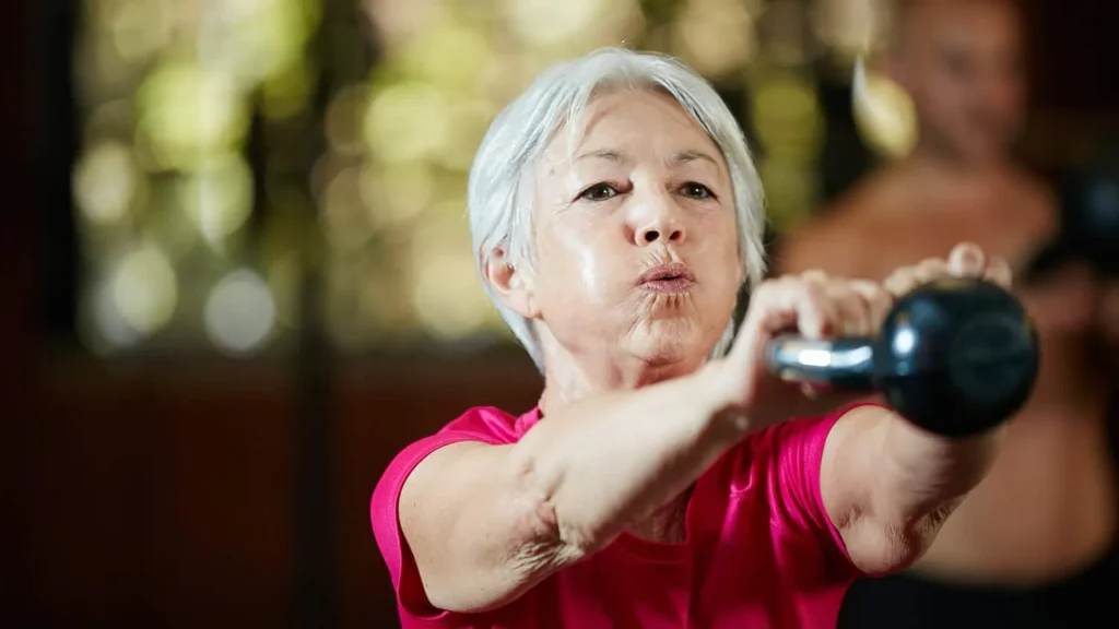 Toning Bingo Wings: Effective Exercises and Tips for Achieving Sleeker Arms 2 Person performing arm exercises with dumbbells Purfleet